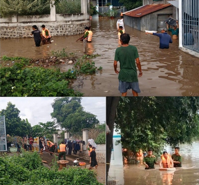 Lực lượng công an ngâm mình trong nước, ứng cứu người dân bị nước lũ cô lập. Ảnh: Công an cung cấp